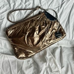 Lulus Rose Gold Metallic wristlet with charm with zip.